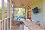 Screen Porch with dining table and TV
